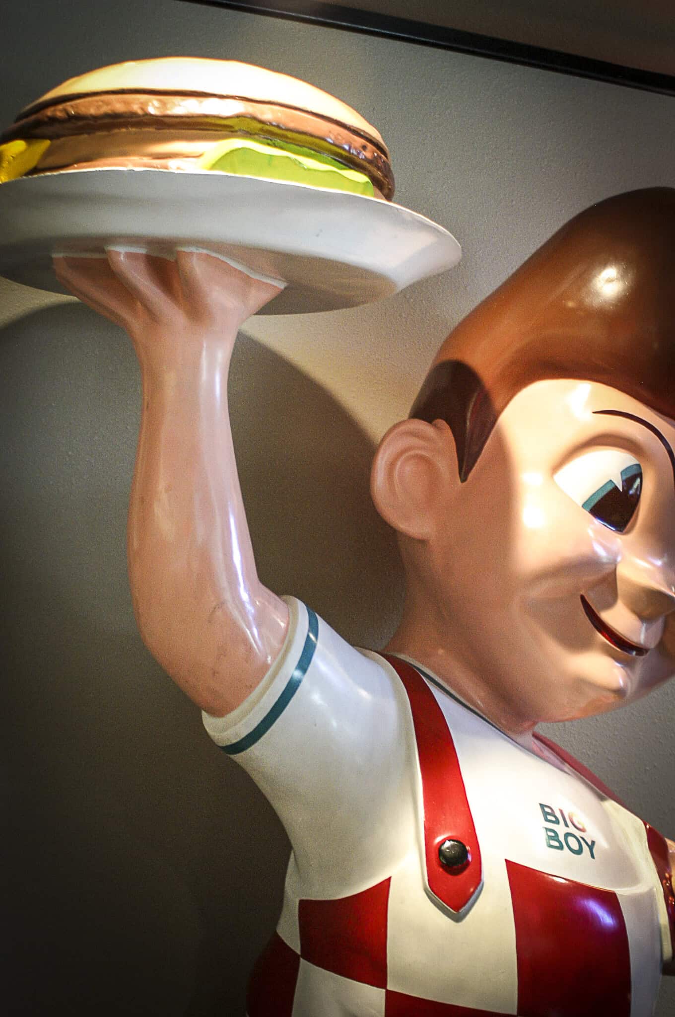 Classic Burger Boy statue holding a tray with a burger at Highway 39 Event Center.