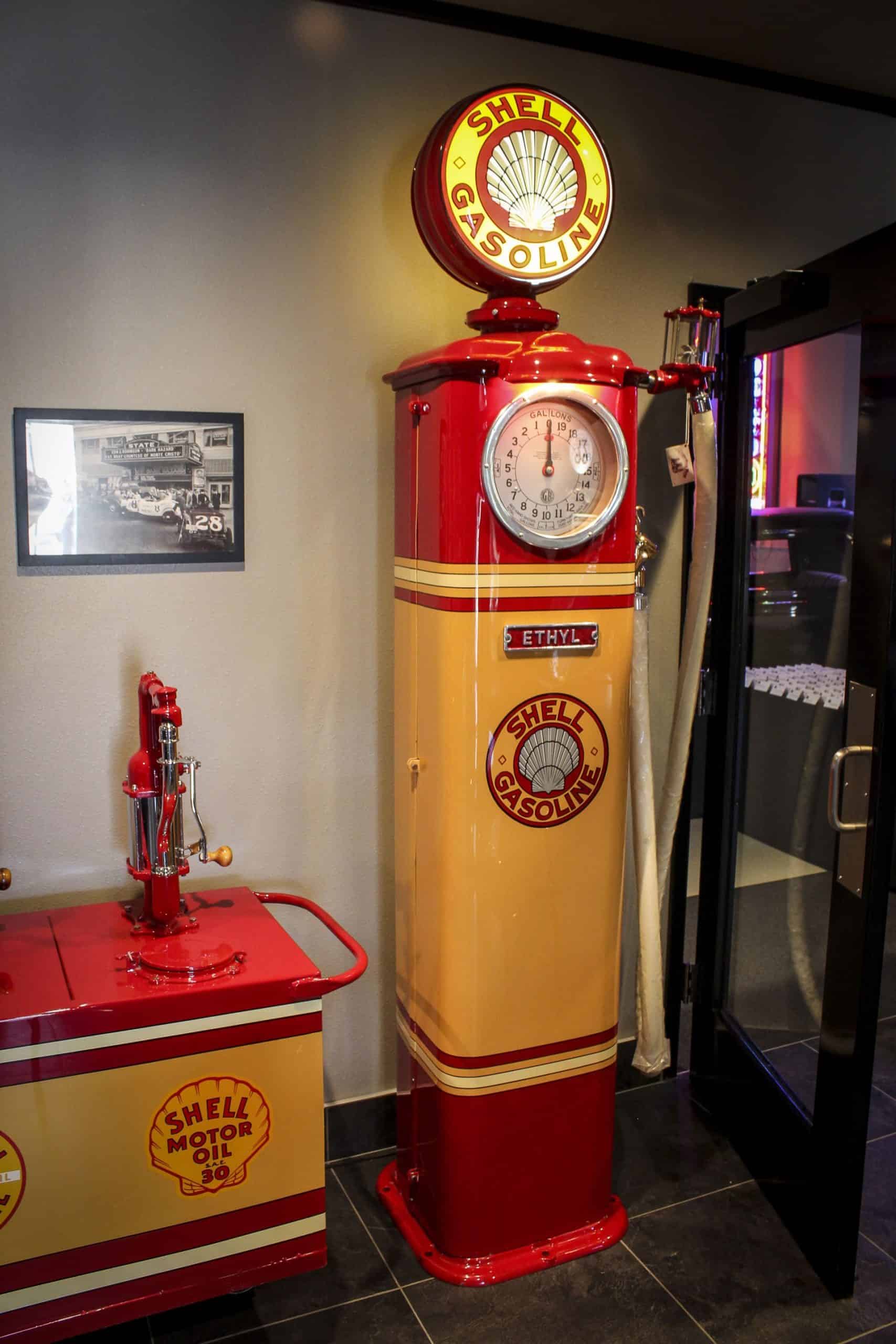 Vintage Shell gasoline pump with classic red and yellow branding, part of the automotive memorabilia.
